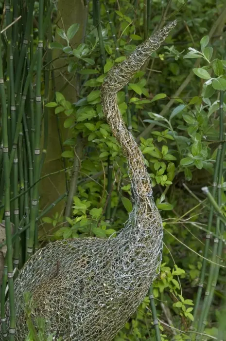 Framed Print : Ornamental wire mesh heron in garden, Norfolk, England, april