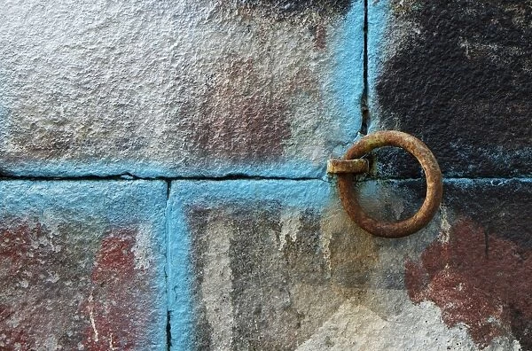 Painted wall and rusted metal loop in harbour, Granville, Manche, Basse-Normandie, Normandy, France, October