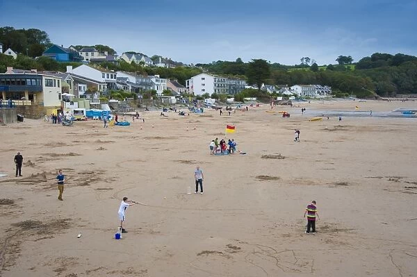 People on beach of seaside resort, Saundersfoot, Pembrokeshire, Wales, August