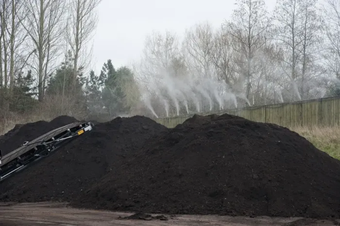 Framed Print : Peppermint perfume spraying over green compost heap at municipal waste site, near Chester, Cheshire, England, march Framed Print : Peppermint perfume spraying over green compost heap at municipal waste site, near Chester, Cheshire, England, march