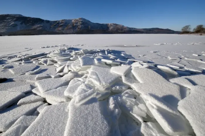 Framed Print : Piles of ice on shore of frozen lake, Derwent Water, Lake District, Cumbria, England, december 2010
