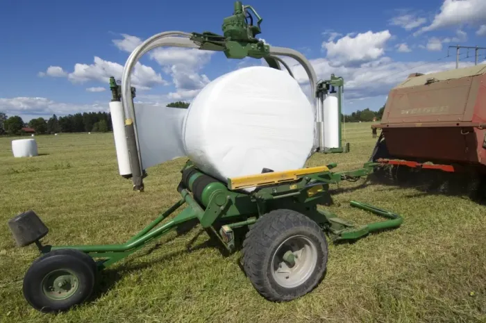 Framed Print : Plastic wrapped round silage bale, wrapped by mechanical bale-wrapper, Sweden Framed Print : Plastic wrapped round silage bale, wrapped by mechanical bale-wrapper, Sweden