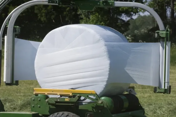 Framed Print : Plastic wrapping round silage bale with mechanical bale-wrapper, Sweden Framed Print : Plastic wrapping round silage bale with mechanical bale-wrapper, Sweden