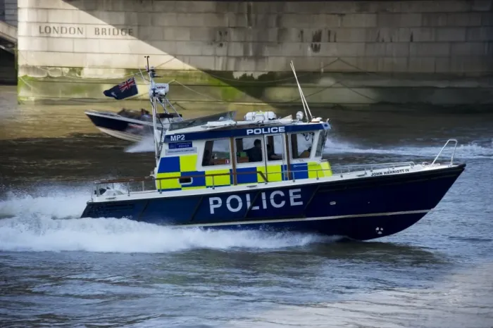Framed Print : Police patrol boat patrolling city river, London Bridge, River Thames, London, England, april Framed Print : Police patrol boat patrolling city river, London Bridge, River Thames, London, England, april