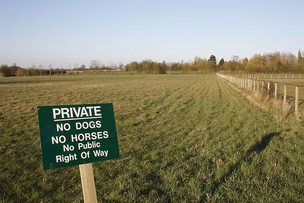 Private, No Dogs, No Horses, No Public Right of Way sign, at edge of fallow field, Bacton, Suffolk, England, march