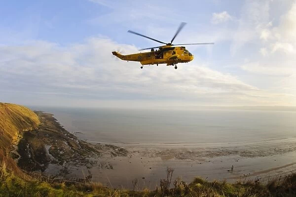 RAF Westland Sea King rescue helicopter with crew members standing in open doorway