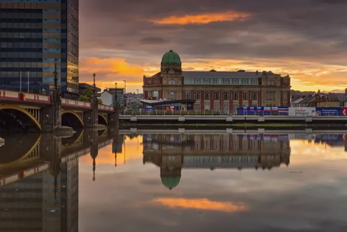 Framed Print : Redeveloped apartment building with copper dome, reflected in river at sunrise, Newport Technical Institute, River Usk Framed Print : Redeveloped apartment building with copper dome, reflected in river at sunrise, Newport Technical Institute, River Usk