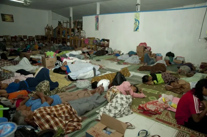 Framed Print : Refugees from recent volcanic eruption, sleeping in dormitory, near Jogyakarta, Mount Merapi, Central Java, Indonesia Framed Print : Refugees from recent volcanic eruption, sleeping in dormitory, near Jogyakarta, Mount Merapi, Central Java, Indonesia