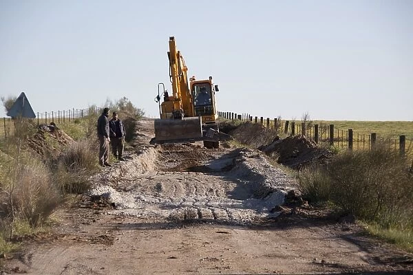 Repairing the road at Belen, Extremadura, Spain. the Cortijo Belen Road is well known to Bird watchers for the great