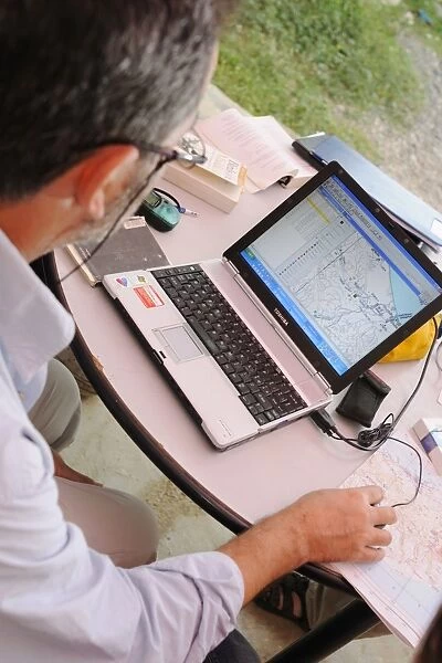 Researcher plotting survey data on GIS software, Socotra, Yemen, december