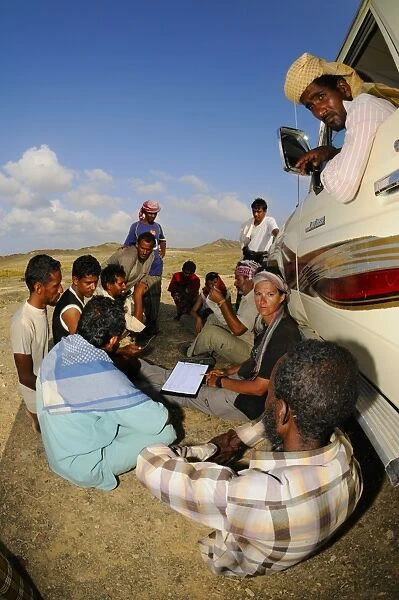 Researchers explaining to local people purpose of survey on island, Abd el-Kuri Island, Socotra, Yemen, april