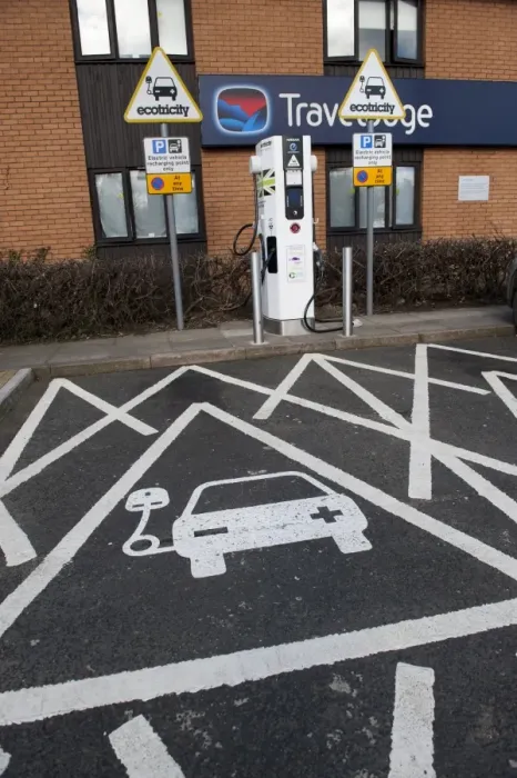 Framed Print : Reserved parking bay at recharging point for electric cars at motorway service area, England, April Framed Print : Reserved parking bay at recharging point for electric cars at motorway service area, England, April