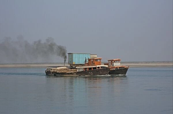 Two river ferries in tandem, carrying truck over river, Lohit River, Assam, India, january