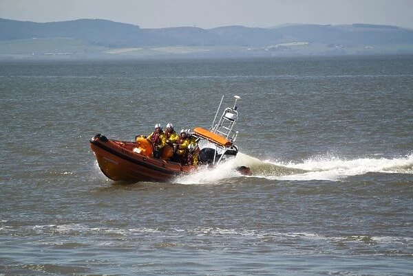 RNLI B-class Atlantic 85 rigid inflatable lifeboat, on training manoeuvres at sea, Silloth, Solway Bay, Cumbria