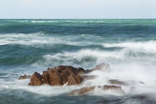 Rocks and waves at high tide, blurred movement, Jersey, Channel Islands, May