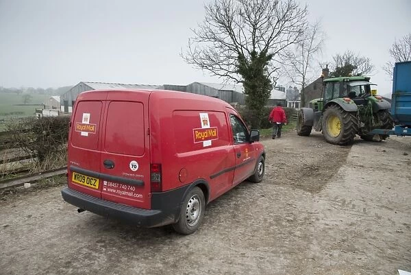 Royal Mail van and postman, delivering post to farm, Preston, Lancashire, England, March
