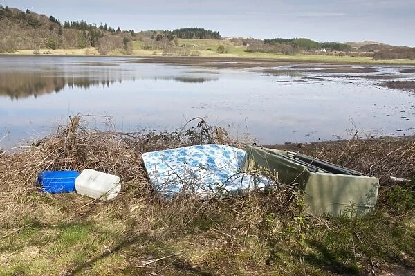 Rubbish dumped at edge of loch, Kilmore, Argyll and Bute, Scotland, april