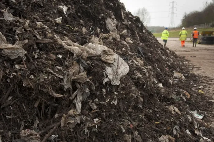 Framed Print : Rubbish filtered from green compost waste at municipal waste site, near Chester, Cheshire, England, march Framed Print : Rubbish filtered from green compost waste at municipal waste site, near Chester, Cheshire, England, march