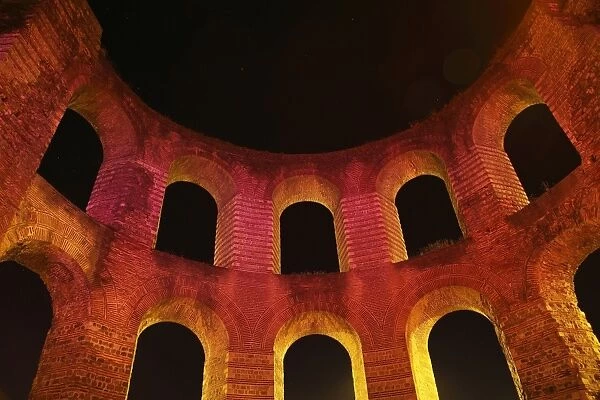 Ruins of Roman baths illuminated at night, Kaiserthermen (Imperial Baths), Trier, Rhineland-Palatinate, Germany, august