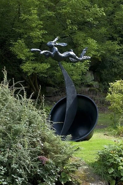 Running hare sculpture in garden of stately home, Chatsworth House, Derbyshire, England, August
