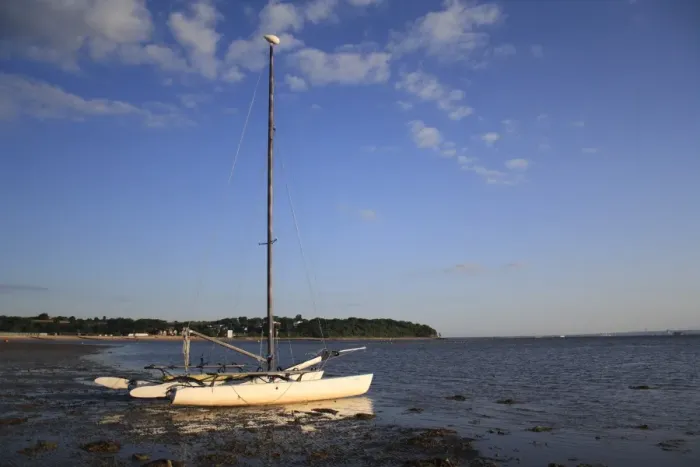 Framed Print : Sailing boat moored on beach with incoming tide, Bembridge, Isle of Wight, England, june