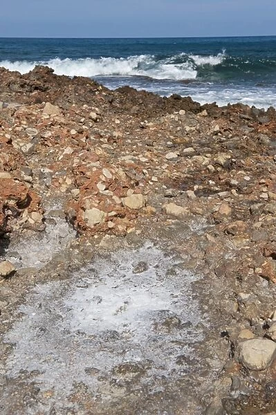 Salt forming on rocks after evaporation of sea water, Les Rotes Beach, Denia, Marina Alta, Costa Blanca