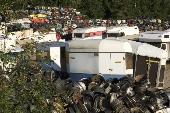 Framed Print : Scrapyard with wheel hubs, caravans and crushed cars, Sweden Framed Print : Scrapyard with wheel hubs, caravans and crushed cars, Sweden