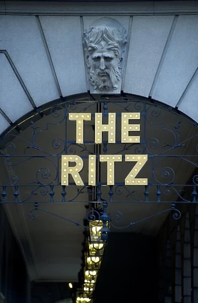 Sign above hotel arcade entrance, The Ritz Hotel, Piccadilly, London, England, april