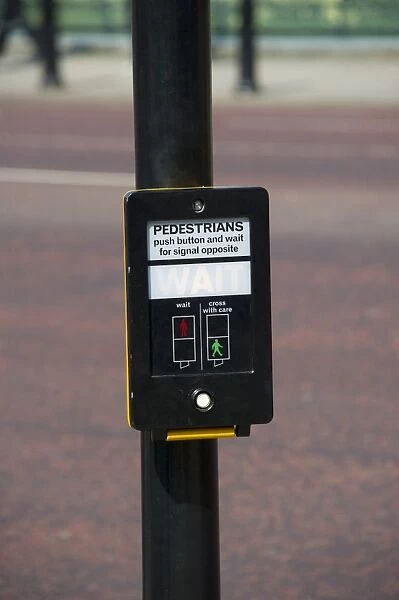 Signal at pedestrian crossing in city, London, England, april