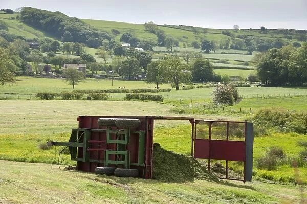 Silage trailer overturned in field, near Longridge, Lancashire, England, may
