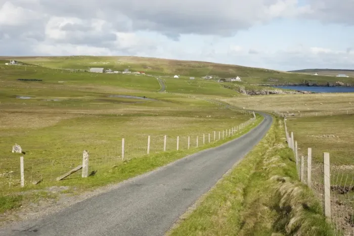 Framed Print : Single track road through coastal pasture, Fetlar, Shetland Islands, Scotland, June
