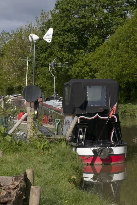 Framed Print : Small wind turbine on narrowboat, supplying energy to domestic items, Oxfordshire, England, may