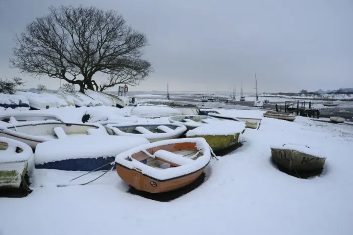 Framed Print : Snow covered boats moored at edge of mudflats, Holbrook Creek, River Stour, Stour Estuary, Lower Holbrook Framed Print : Snow covered boats moored at edge of mudflats, Holbrook Creek, River Stour, Stour Estuary, Lower Holbrook