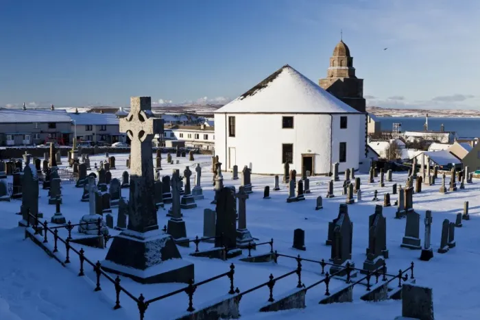 Framed Print : Snow covered cemetery and round church, Kilarrow Parish Church, Bowmore, Isle of Islay, Inner Hebrides, Scotland Framed Print : Snow covered cemetery and round church, Kilarrow Parish Church, Bowmore, Isle of Islay, Inner Hebrides, Scotland