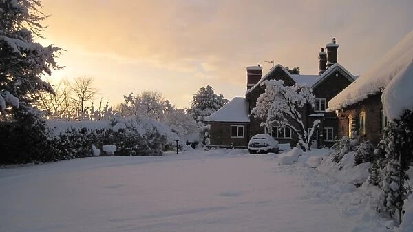 Snow covered garden and house, Riverhead, Nottinghamshire, England, December