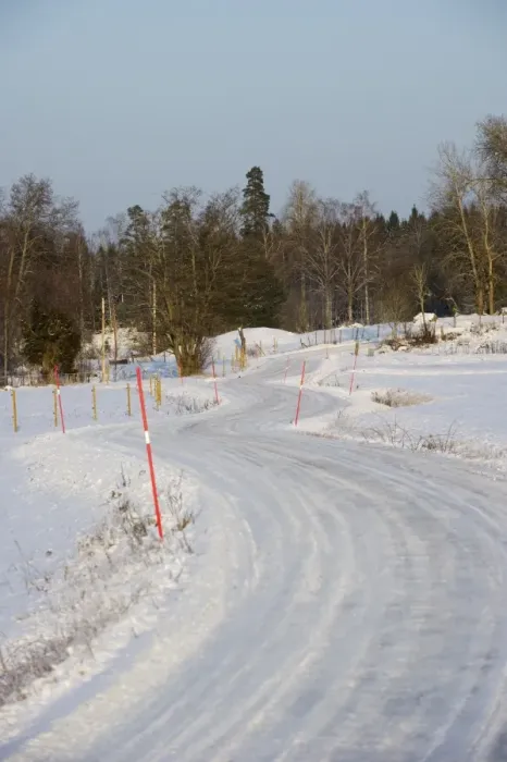 Framed Print : Snow covered road with markers, Sweden, february