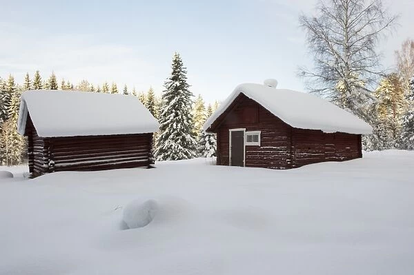 Snow covered wooden barns, Sweden, december