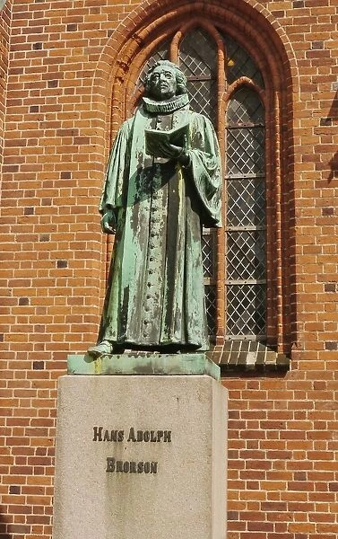 Statue of Hans Adolph Brorson (1694 - 1764), standing beside cathedral in historic town