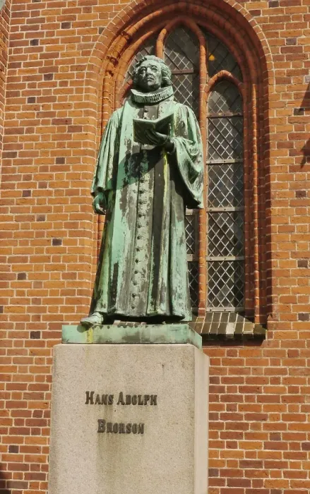 Framed Print : Statue of Hans Adolph Brorson (1694 - 1764), standing beside cathedral in historic town