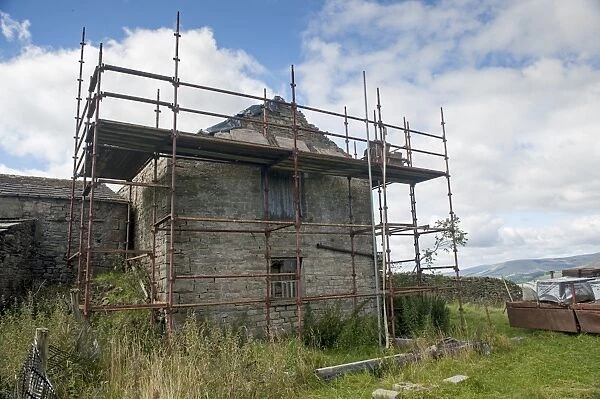 Stone barn with planning permisson to convert to cottage, with scaffolding around, Hawes, Wensleydale