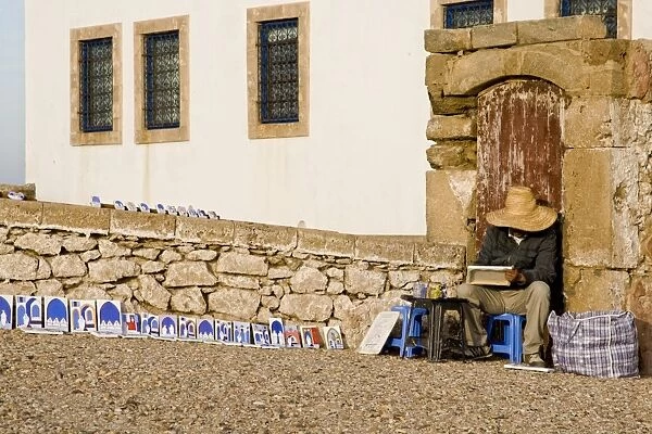 Street painter in coastal city, Essaouira, Morocco, february
