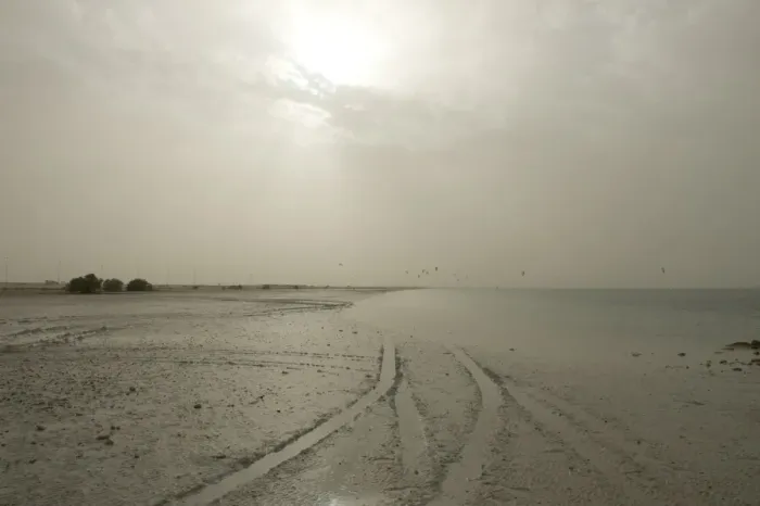 Framed Print : Sudden sandstorm developing over beach blotting out sun and catching distant kite surfers, Arabian Gulf, Abu Dhabi Framed Print : Sudden sandstorm developing over beach blotting out sun and catching distant kite surfers, Arabian Gulf, Abu Dhabi