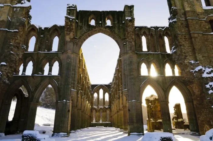Framed Print : Sunlight shining through arched windows of ruined cistercian abbey in snow, Rievaulx Abbey, North York Moors N. P Framed Print : Sunlight shining through arched windows of ruined cistercian abbey in snow, Rievaulx Abbey, North York Moors N. P
