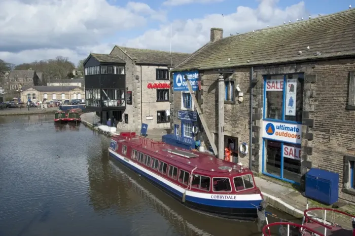 Framed Print : Tour boat and narrowboats moored on canal in town, Leeds and Liverpool Canal, Skipton, North Yorkshire, England, march Framed Print : Tour boat and narrowboats moored on canal in town, Leeds and Liverpool Canal, Skipton, North Yorkshire, England, march