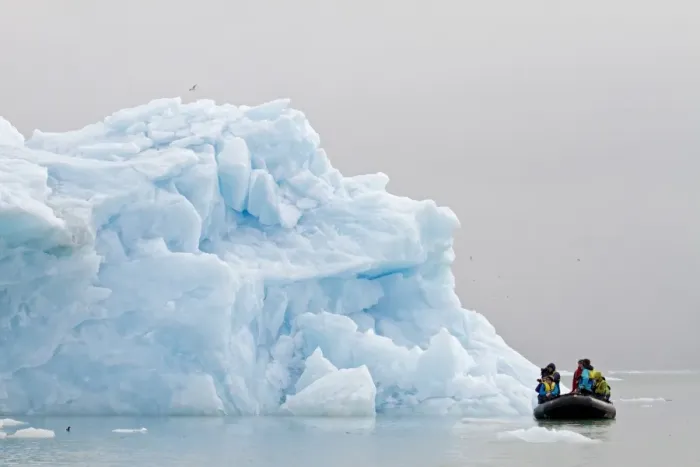 Framed Print : Tourists photographing iceberg from Zodiac inflatable boat, Spitzbergen, Svalbard, july