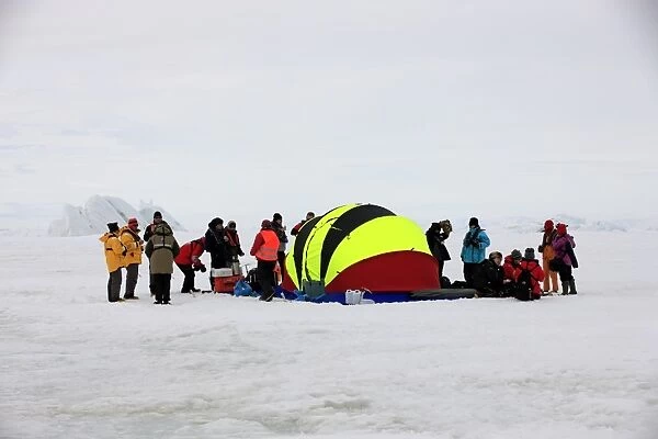 Tourists waiting for helicopter at emergency tent, Devil Island, Weddell Sea, Antarctica, December