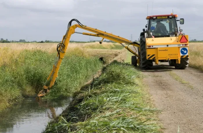 Framed Print : Tractor with boom arm, clearing reed from overgrown dyke, countryside management scheme, near King's Lynn, Norfolk, England, august Framed Print : Tractor with boom arm, clearing reed from overgrown dyke, countryside management scheme, near King's Lynn, Norfolk, England, august