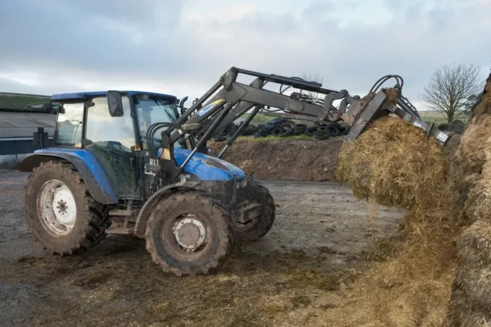 Framed Print : Tractor with loader and grab in silage clamp, England, november Framed Print : Tractor with loader and grab in silage clamp, England, november
