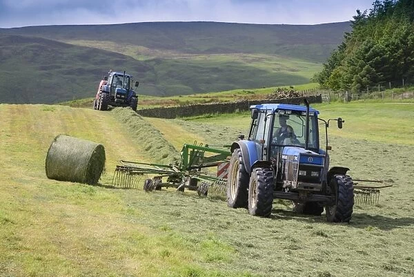 Tractors rowing and baling haylage in field, Chipping, Forest of Bowland, Lancashire, England, June