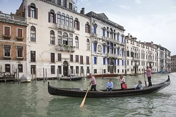 Traghetto ferry with passengers crossing canal, near Rialto Bridge, Grand Canal, San Marco District, Venice, Veneto